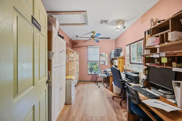 a living room with furniture a table and a flat screen tv