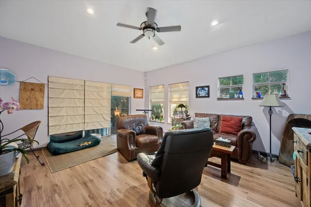 a view of a kitchen with fridge and workspace
