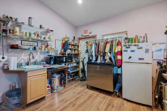 a view of a bathroom with a sink and mirror