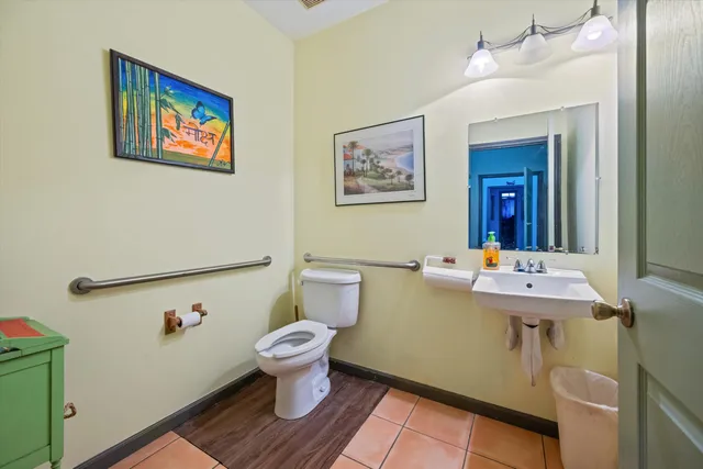 a room with wooden floor and furniture