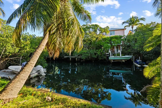a view of a house with pool and wooden floor