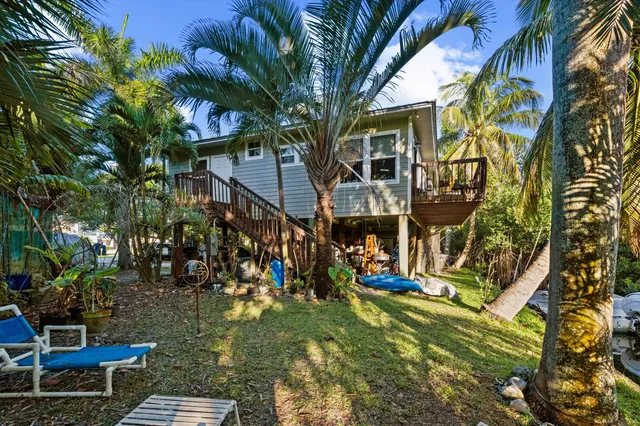a view of a lake with couches and wooden floor
