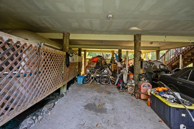 a view of a garage with rack and bicycle
