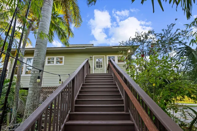 a view of balcony with wooden floor and fence