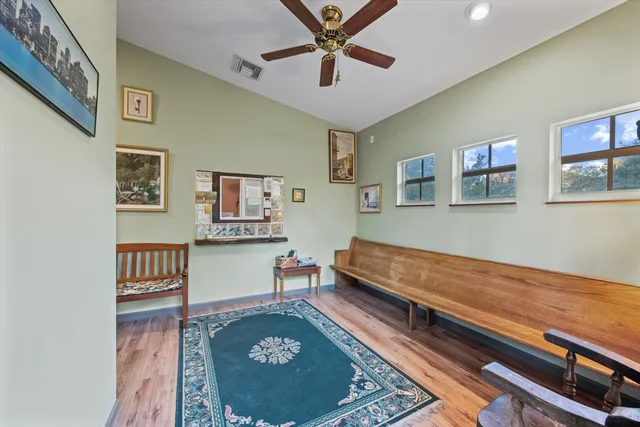 a living room with furniture and a rug