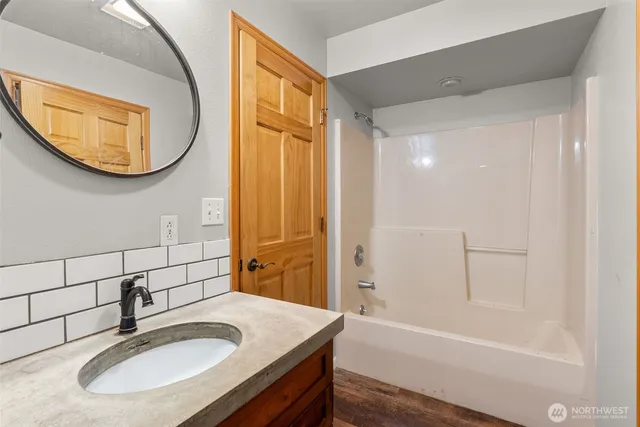 a bathroom with a sink and a mirror