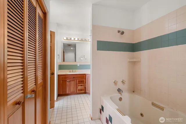 a bathroom with a bathtub and a sink