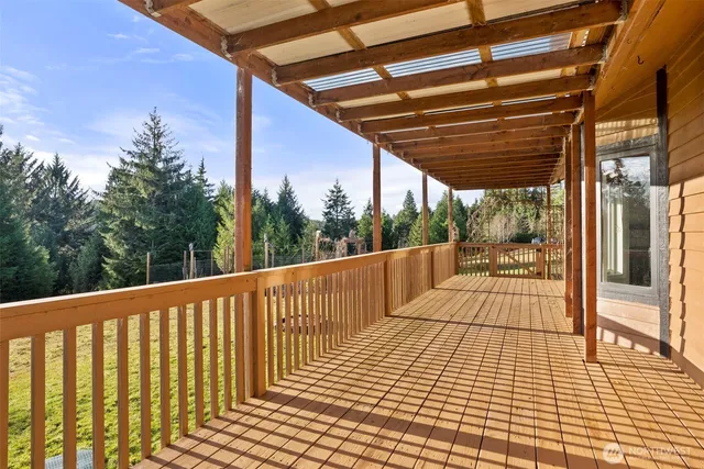 a view of balcony with wooden floor