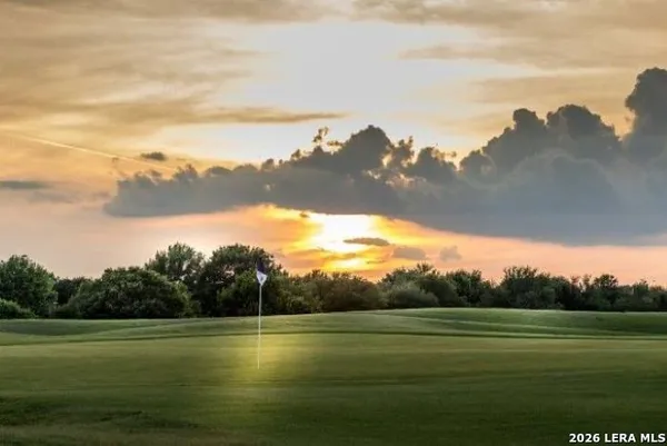 a view of an ocean beach and mountain