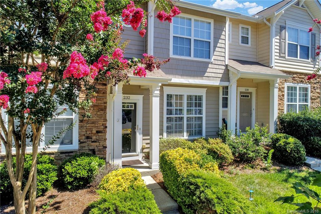 232 Dawn Mist Lane, Unit 40 Fort Mill, SC 29708 - Photo 1 of 28 a front view of a house having yard