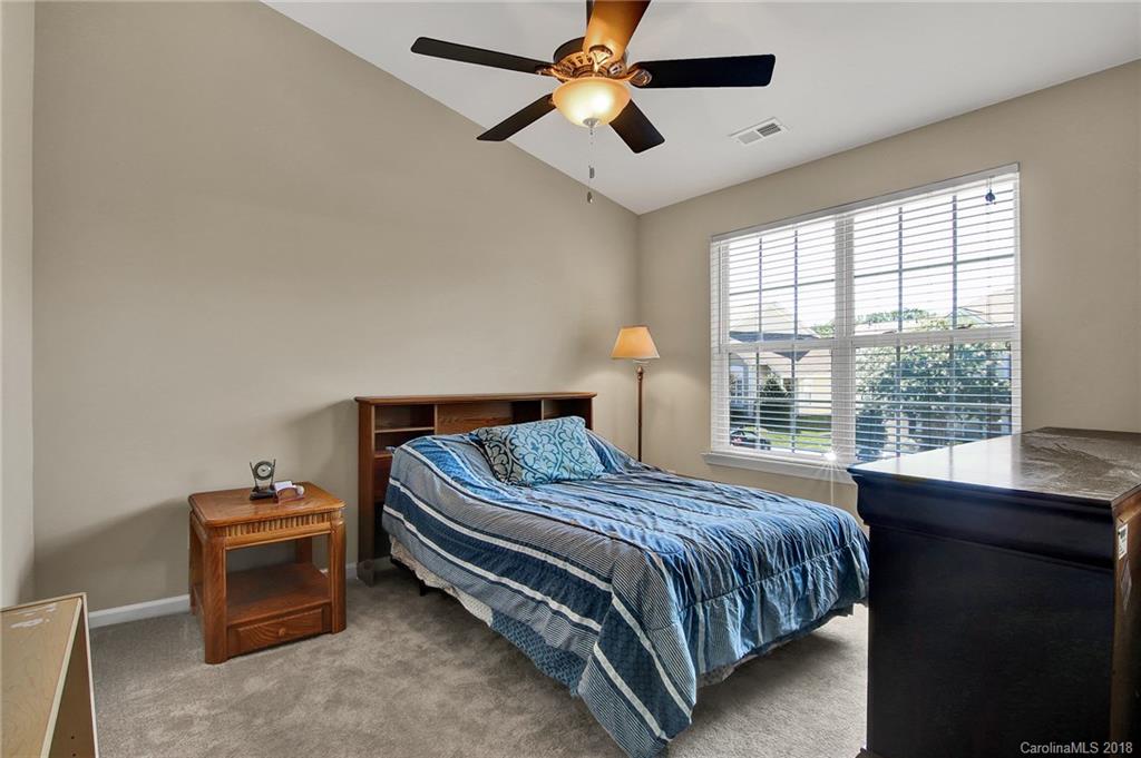 232 Dawn Mist Lane, Unit 40 Fort Mill, SC 29708 - Photo 13 of 28 a bedroom with a bed and a window