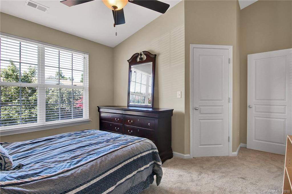 232 Dawn Mist Lane, Unit 40 Fort Mill, SC 29708 - Photo 14 of 28 a bedroom with a bed and a window