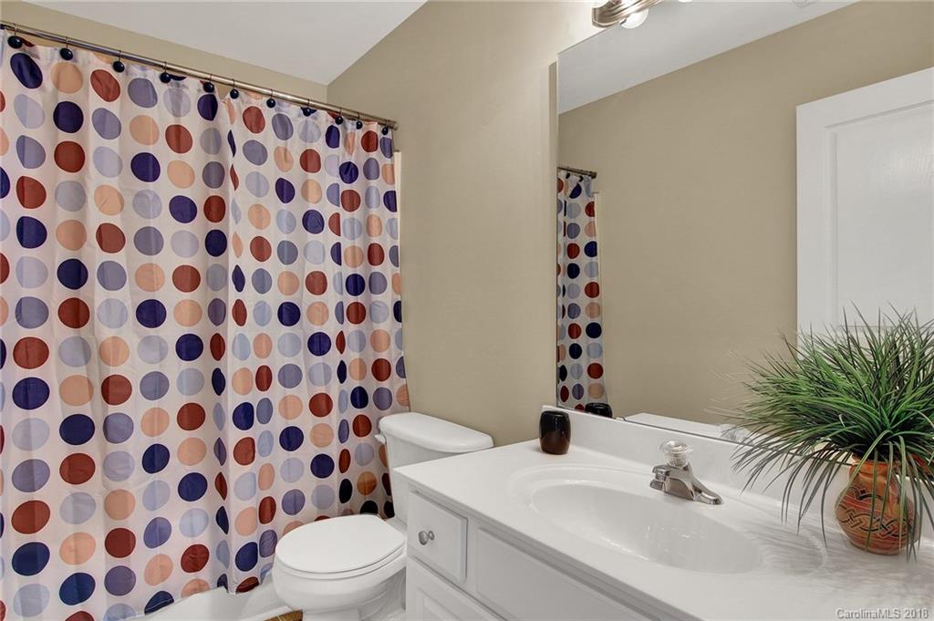 232 Dawn Mist Lane, Unit 40 Fort Mill, SC 29708 - Photo 19 of 28 a bathroom with a sink toilet and shower