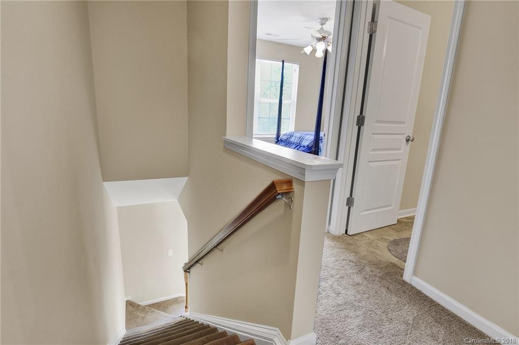 232 Dawn Mist Lane, Unit 40 Fort Mill, SC 29708 - Photo 20 of 28 a view of staircase with white walls and a window