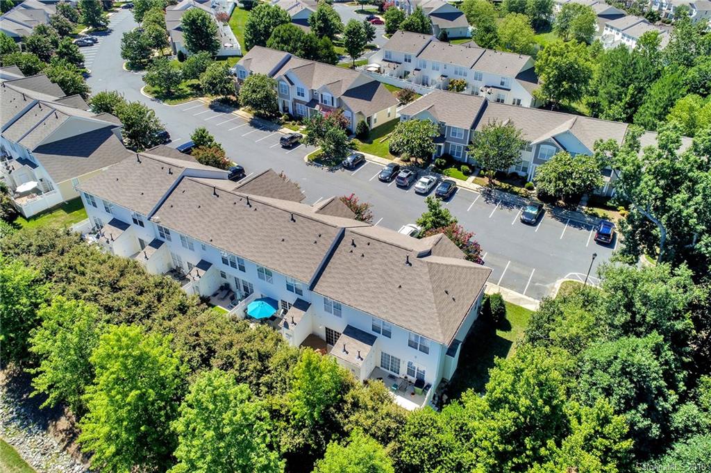 232 Dawn Mist Lane, Unit 40 Fort Mill, SC 29708 - Photo 25 of 28 an aerial view of a house with a yard and lake view