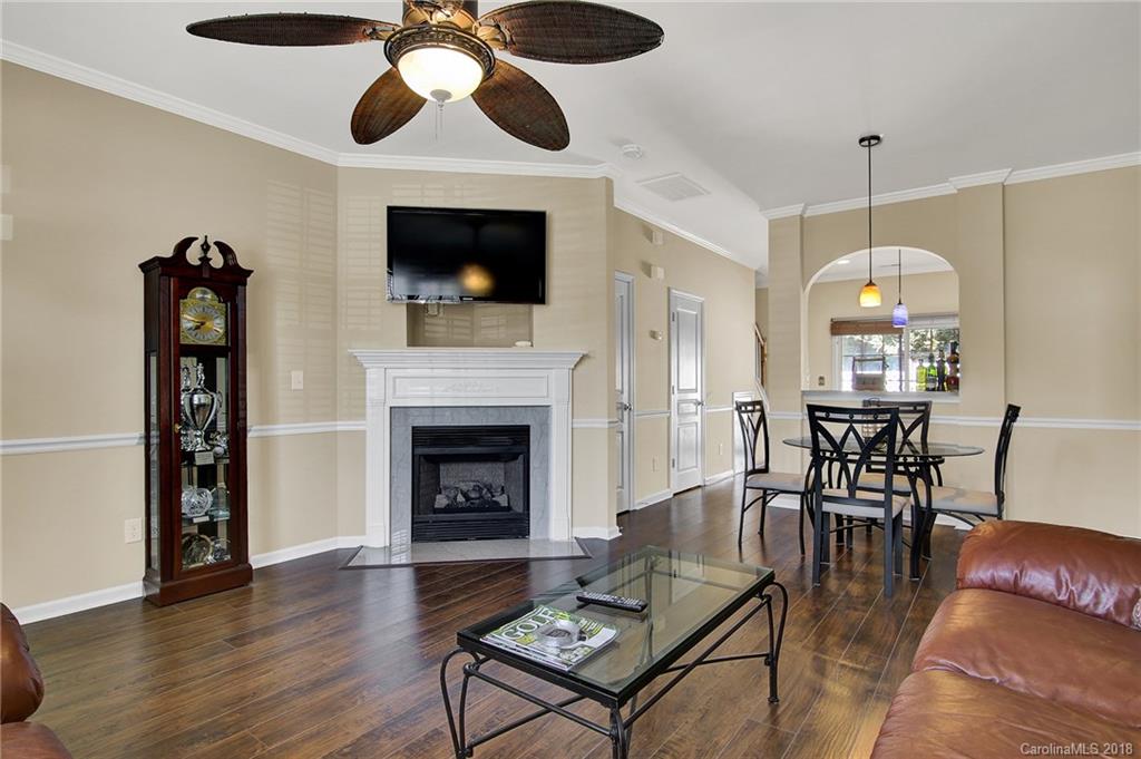 232 Dawn Mist Lane, Unit 40 Fort Mill, SC 29708 - Photo 5 of 28 a living room with furniture a fireplace and a flat screen tv