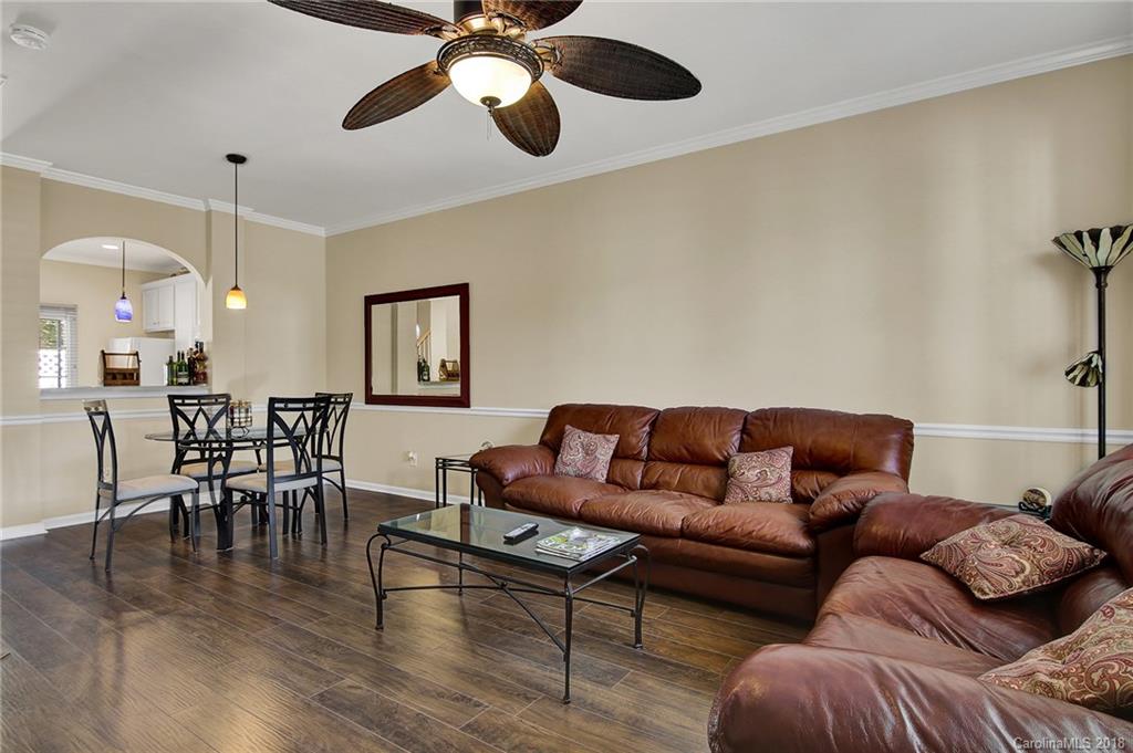 232 Dawn Mist Lane, Unit 40 Fort Mill, SC 29708 - Photo 6 of 28 a living room with furniture and a wooden floor