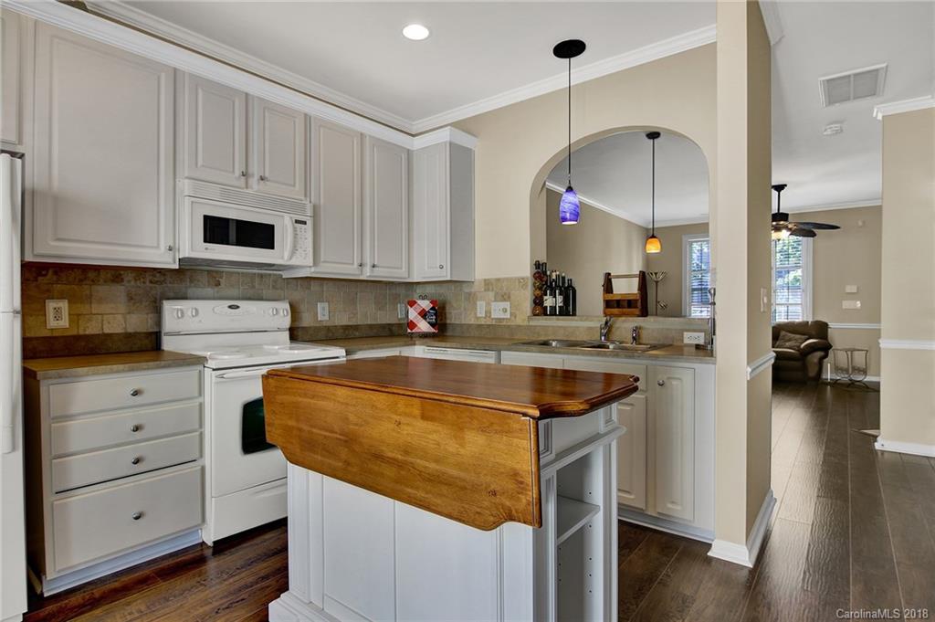 232 Dawn Mist Lane, Unit 40 Fort Mill, SC 29708 - Photo 10 of 28 a kitchen with granite countertop a sink and cabinets