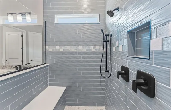 a bathroom with a sink and mirror