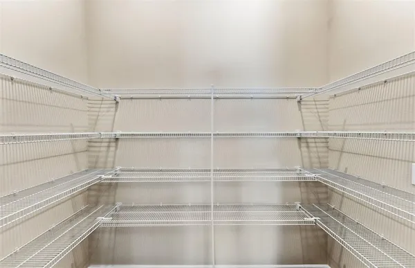 a view of a room with racks on the wall