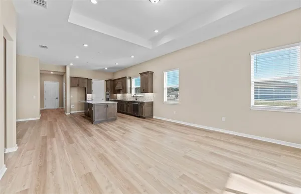 a view of kitchen and refrigerator