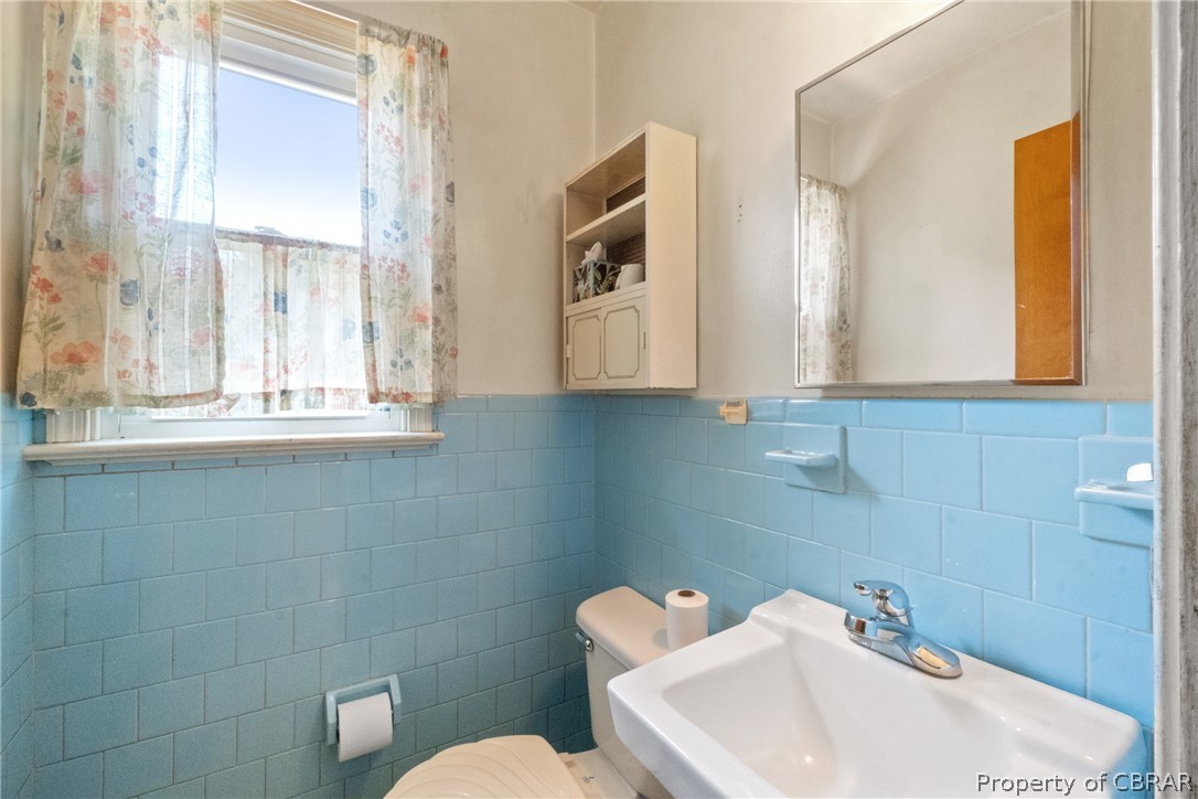 3721 Winterhaven Road Midlothian, VA 23112 - Photo 13 of 25 Bathroom with tile walls, toilet, and a wealth of natural light