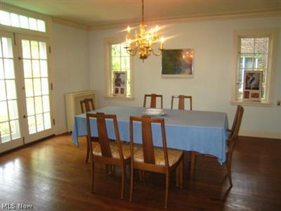 3317 Ingleside Road Shaker Heights, OH 44122 - Photo 5 of 19 Formal dining room with floor to ceiling front windows and open to large open eat in kitchen.