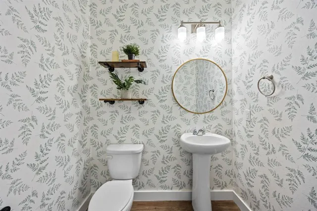 a bathroom with a toilet and a sink