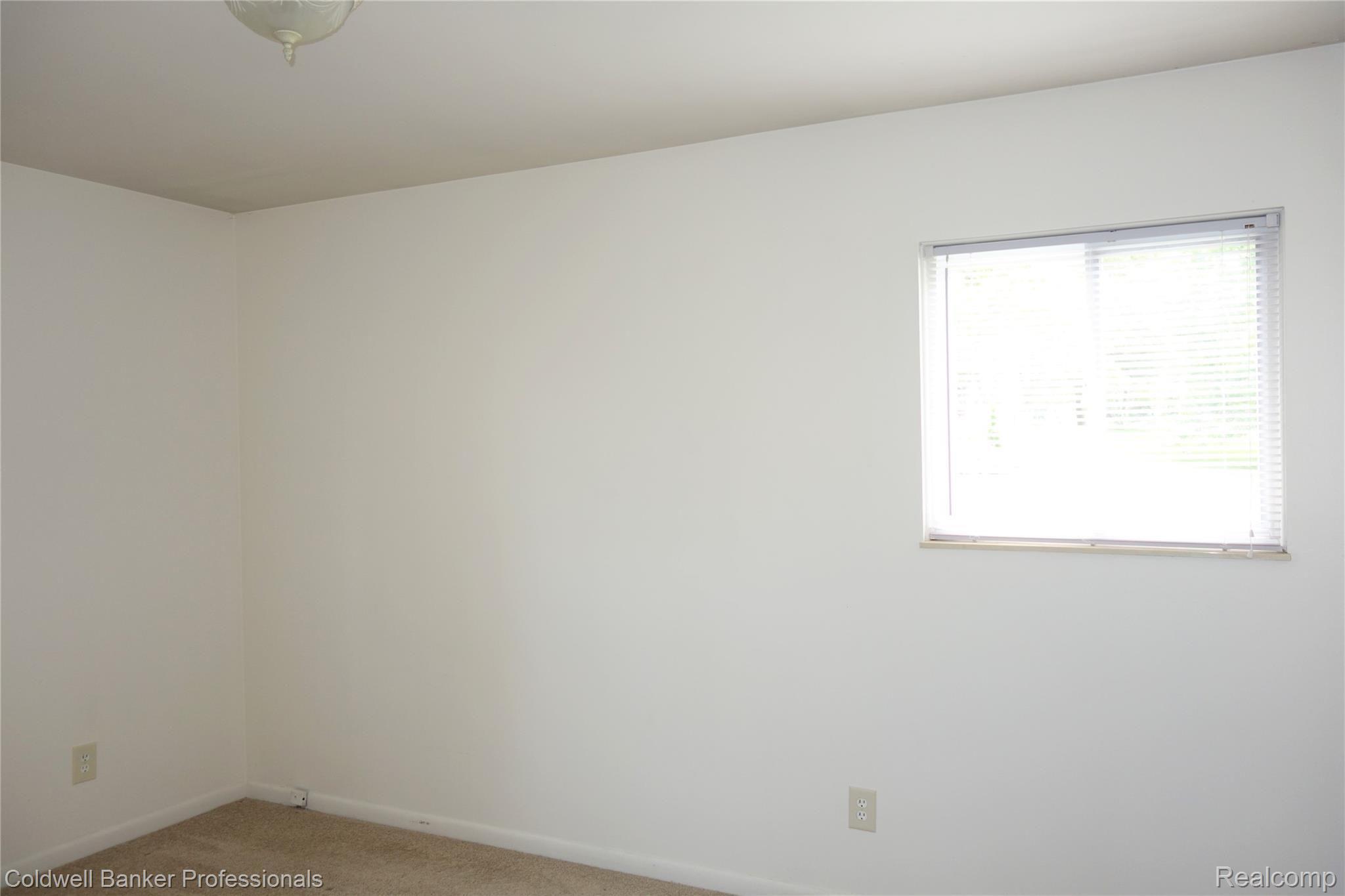 6657 Waldon Road Clarkston, MI 48346 - Photo 6 of 27 Bedroom has large window, new carpet and plenty of closet space