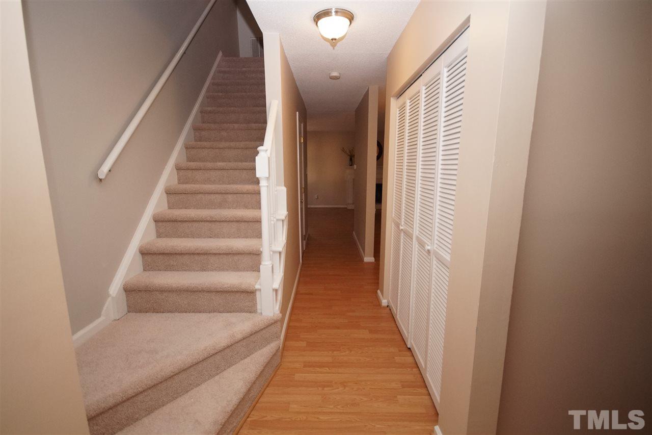 5719 Pool Side Drive Raleigh, NC 27612 - Photo 2 of 23 a view of a hallway with wooden floor and entryway