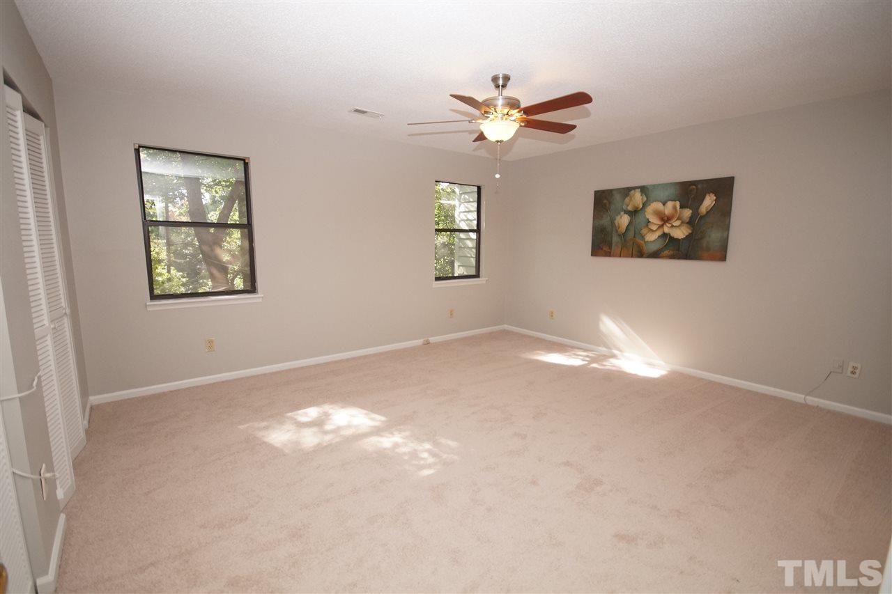 5719 Pool Side Drive Raleigh, NC 27612 - Photo 14 of 23 a view of an empty room with window