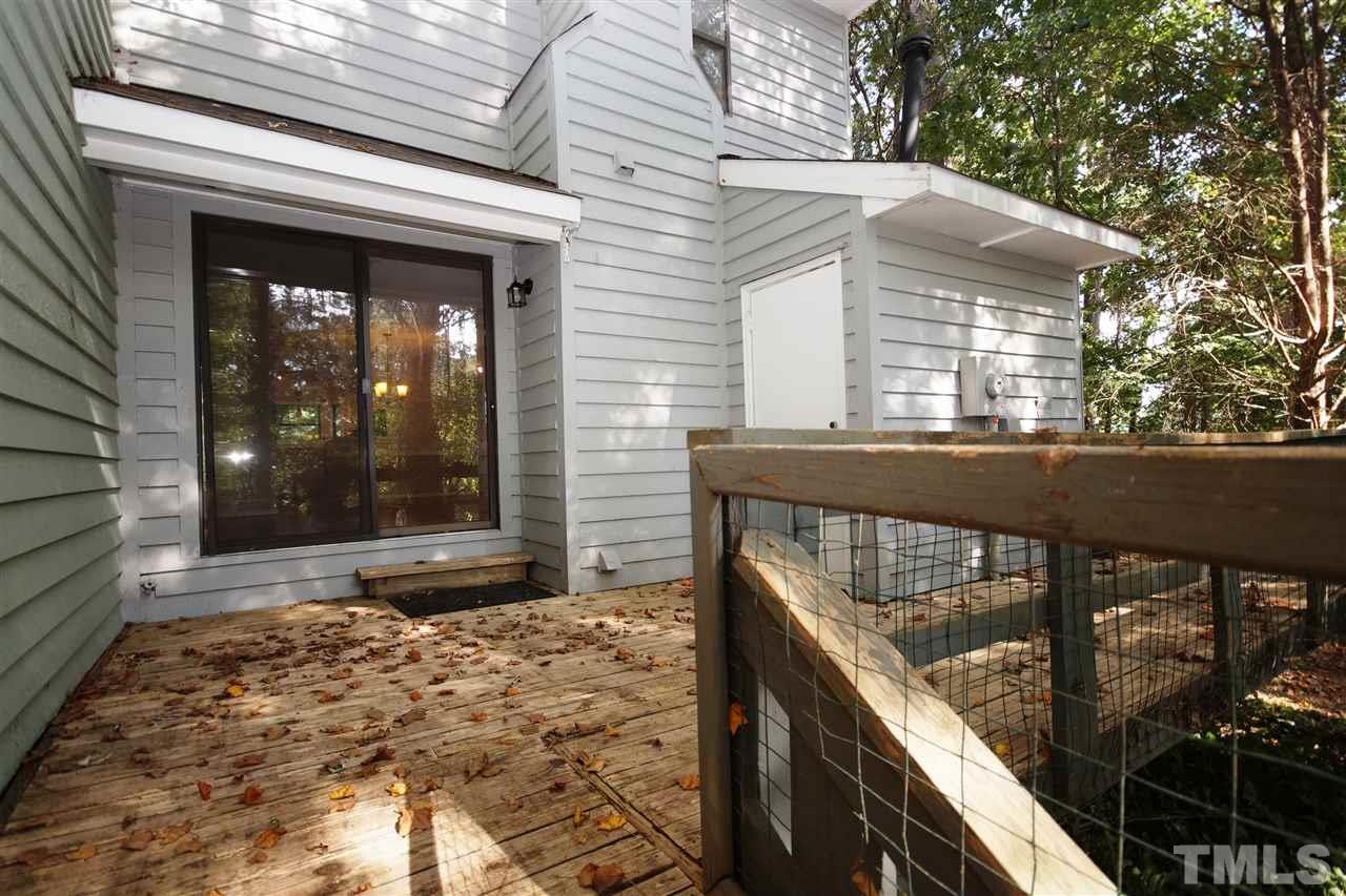 5719 Pool Side Drive Raleigh, NC 27612 - Photo 21 of 23 a view of a porch with a bench