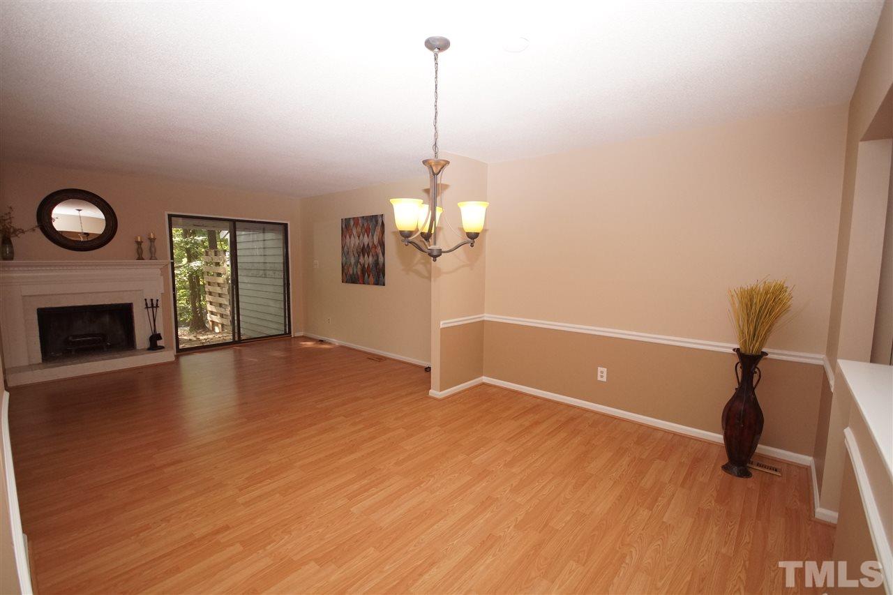 5719 Pool Side Drive Raleigh, NC 27612 - Photo 8 of 23 a view of empty room with wooden floor and fan