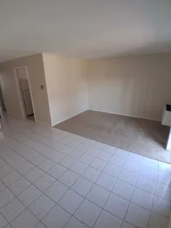 an empty room with a bench