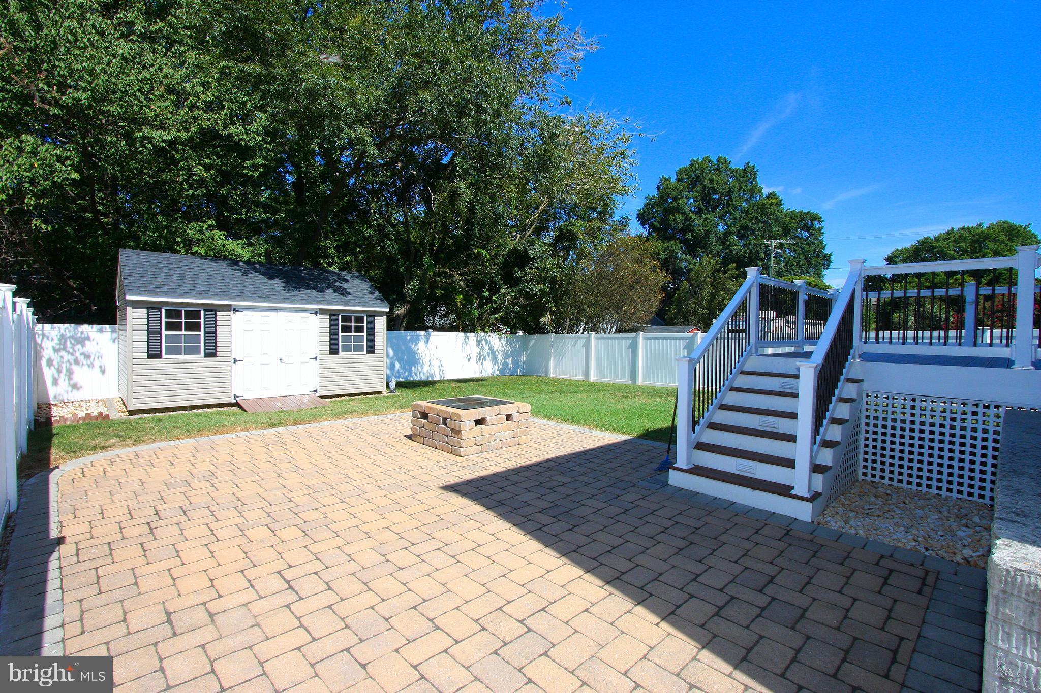 234 Carvel Road Pasadena, MD 21122 - Photo 26 of 30 Stone patio, composite deck, fenced yard.