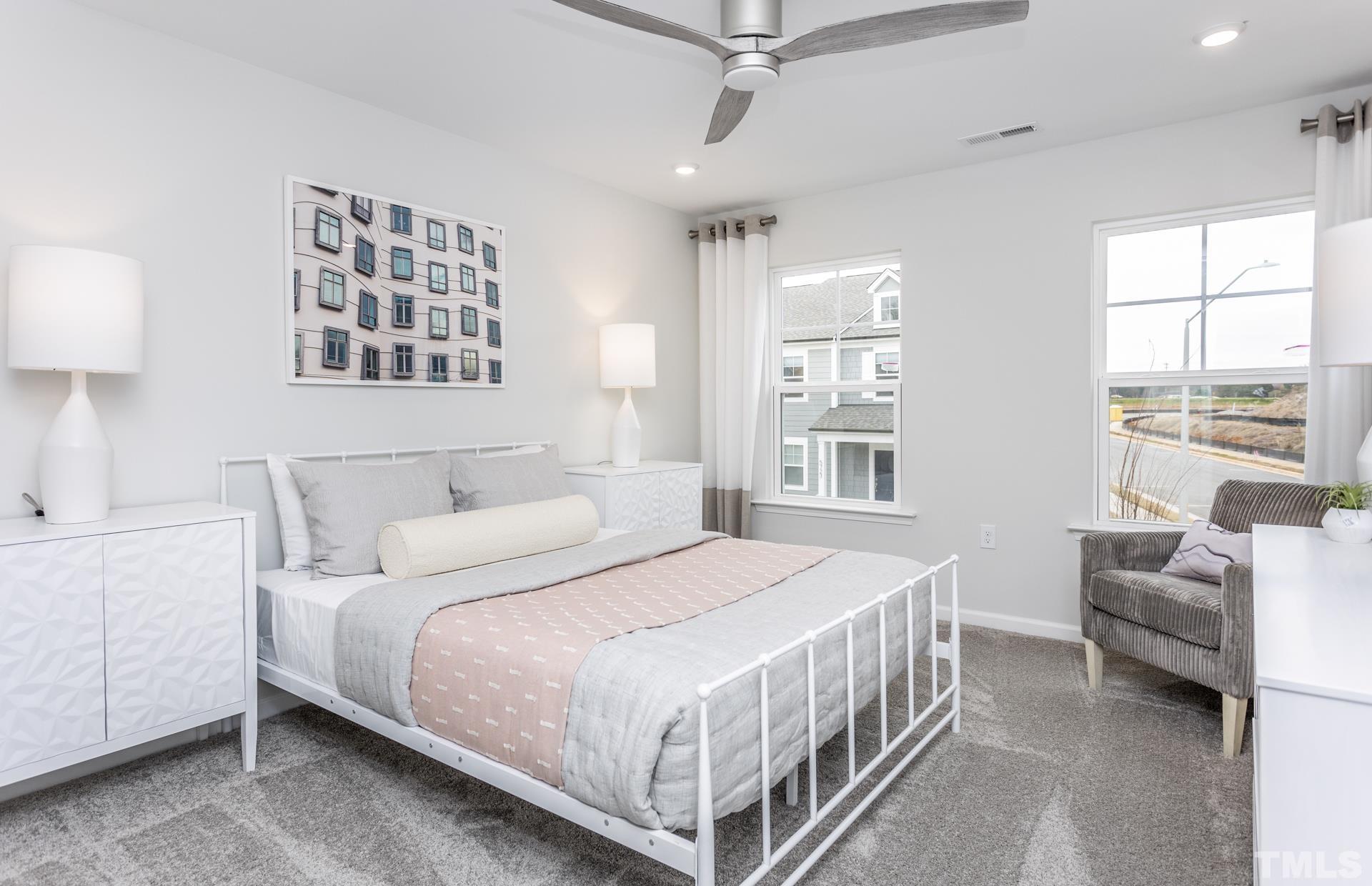 2400 Hedge Maple Drive, Unit ROYAL Raleigh, NC 27603 - Photo 6 of 16 a bedroom with a bed a couch and dresser
