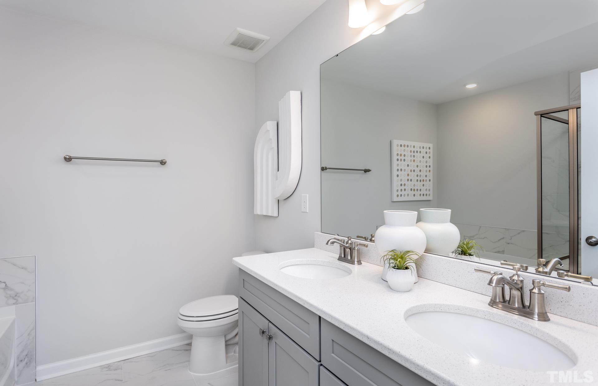 2400 Hedge Maple Drive, Unit ROYAL Raleigh, NC 27603 - Photo 8 of 16 a bathroom with a sink toilet and mirror