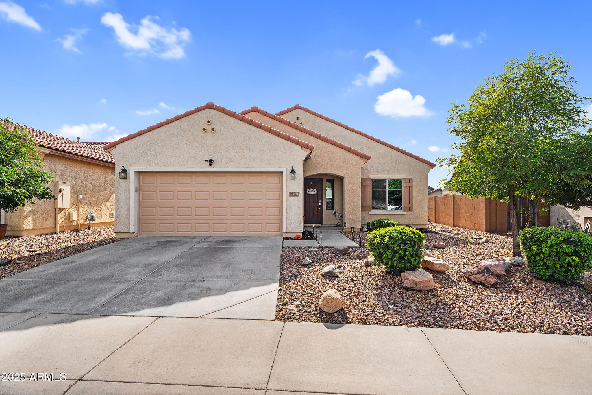6579 West Georgetown Way Florence, AZ 85132 - Photo 1 of 60 a view of a house with a yard and potted plants