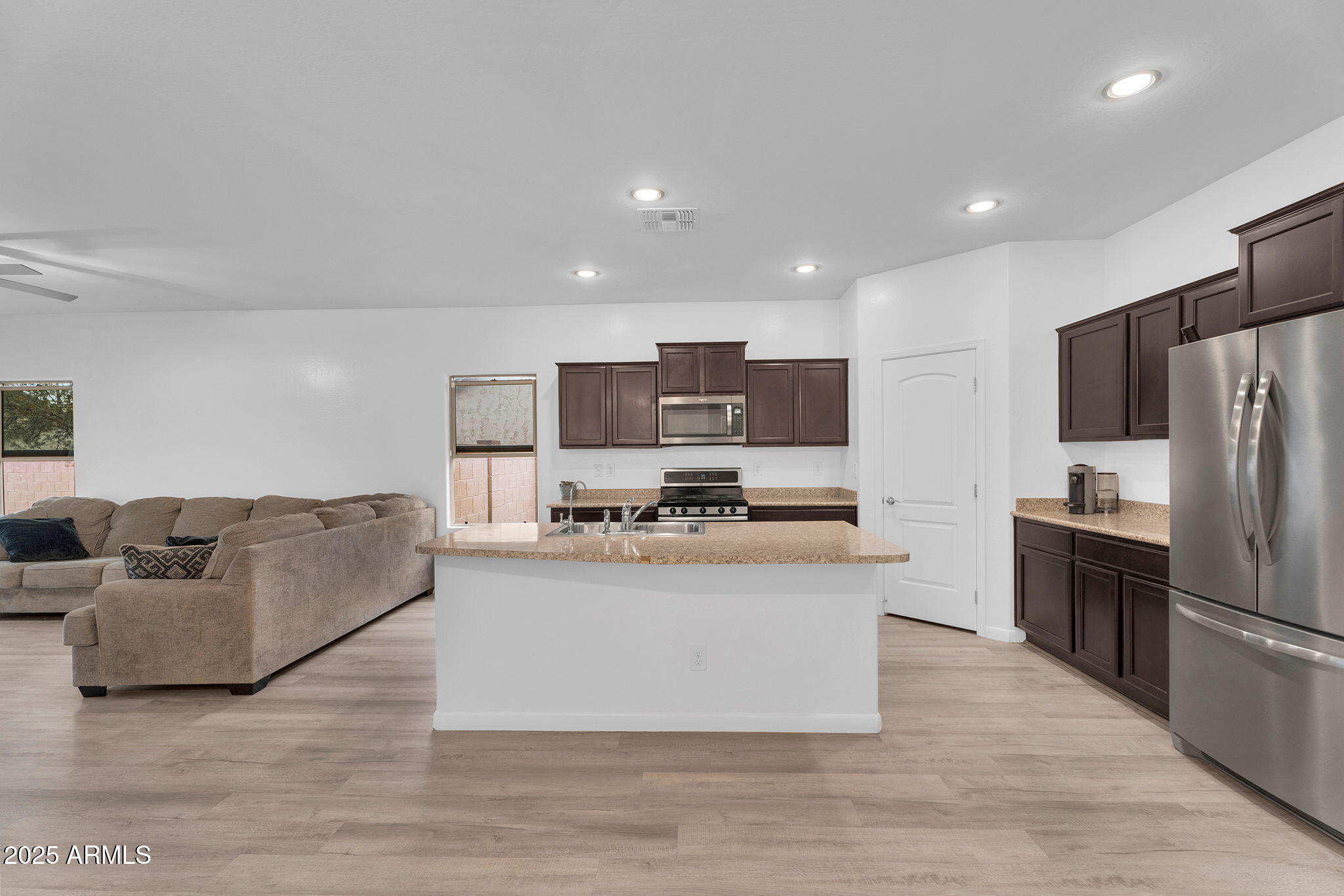 6579 West Georgetown Way Florence, AZ 85132 - Photo 13 of 60 a living room with stainless steel appliances furniture and a view of kitchen