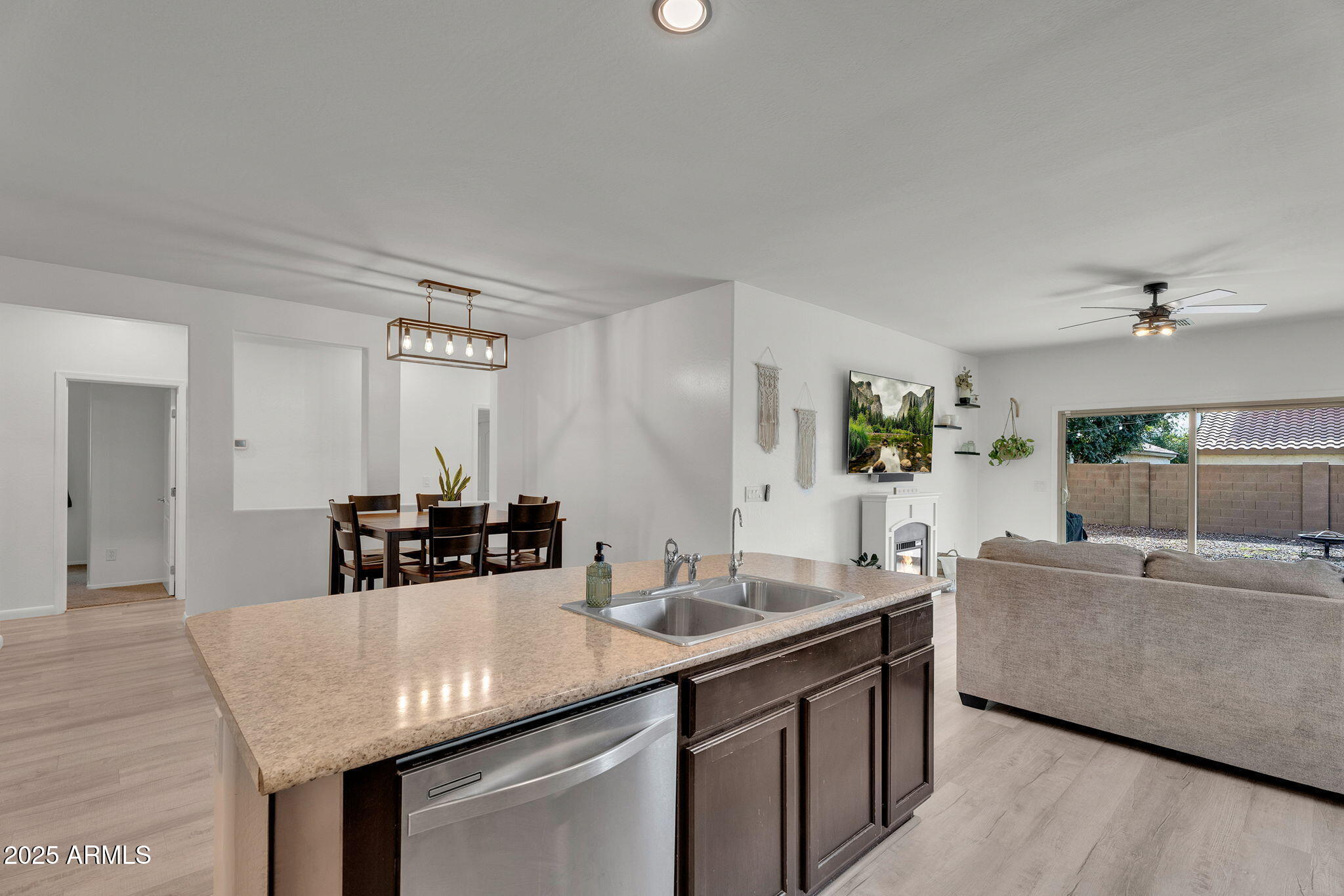 6579 West Georgetown Way Florence, AZ 85132 - Photo 17 of 60 a kitchen with stainless steel appliances granite countertop a sink and a refrigerator