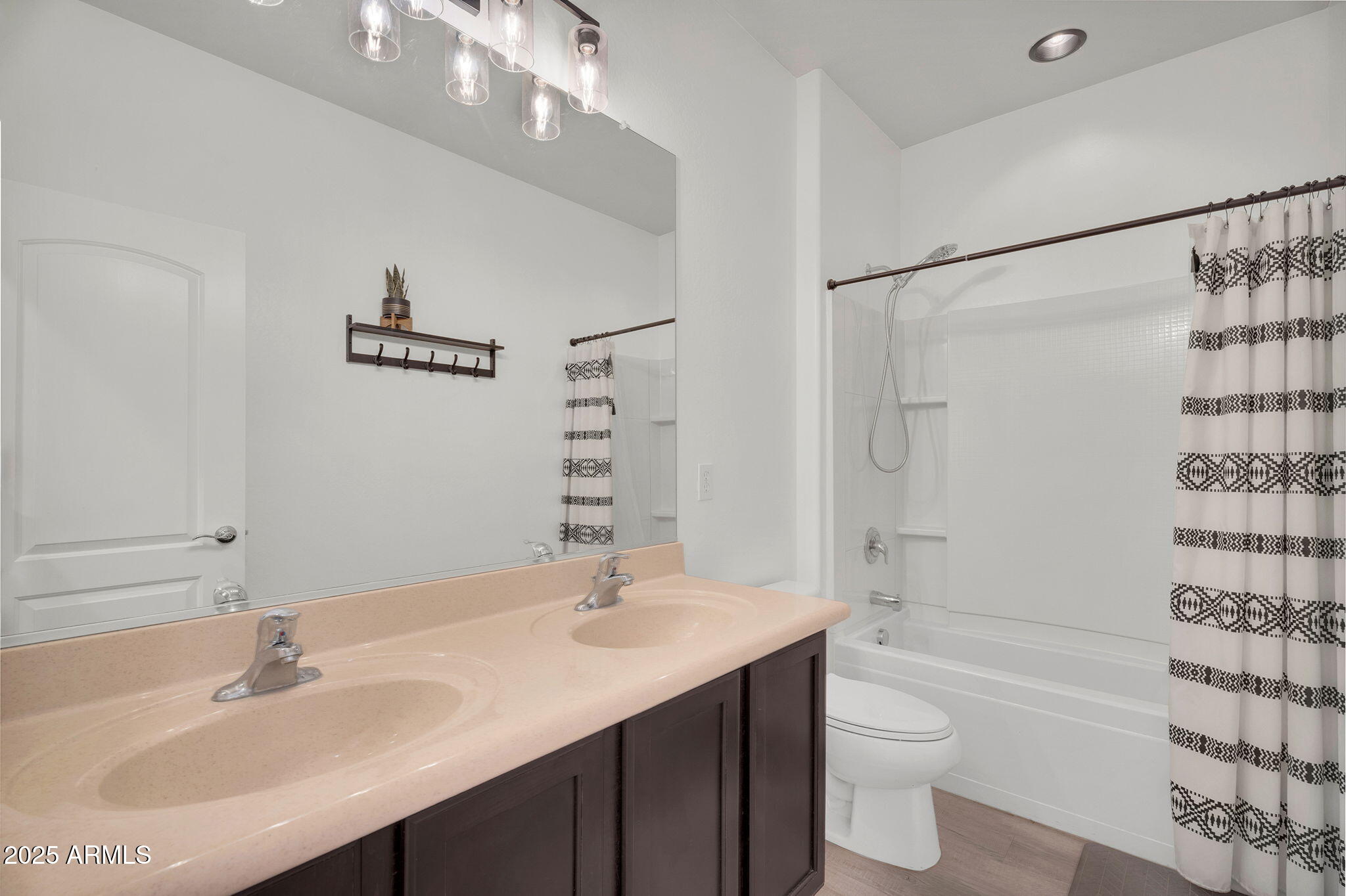 6579 West Georgetown Way Florence, AZ 85132 - Photo 19 of 60 a bathroom with a sink a toilet and shower