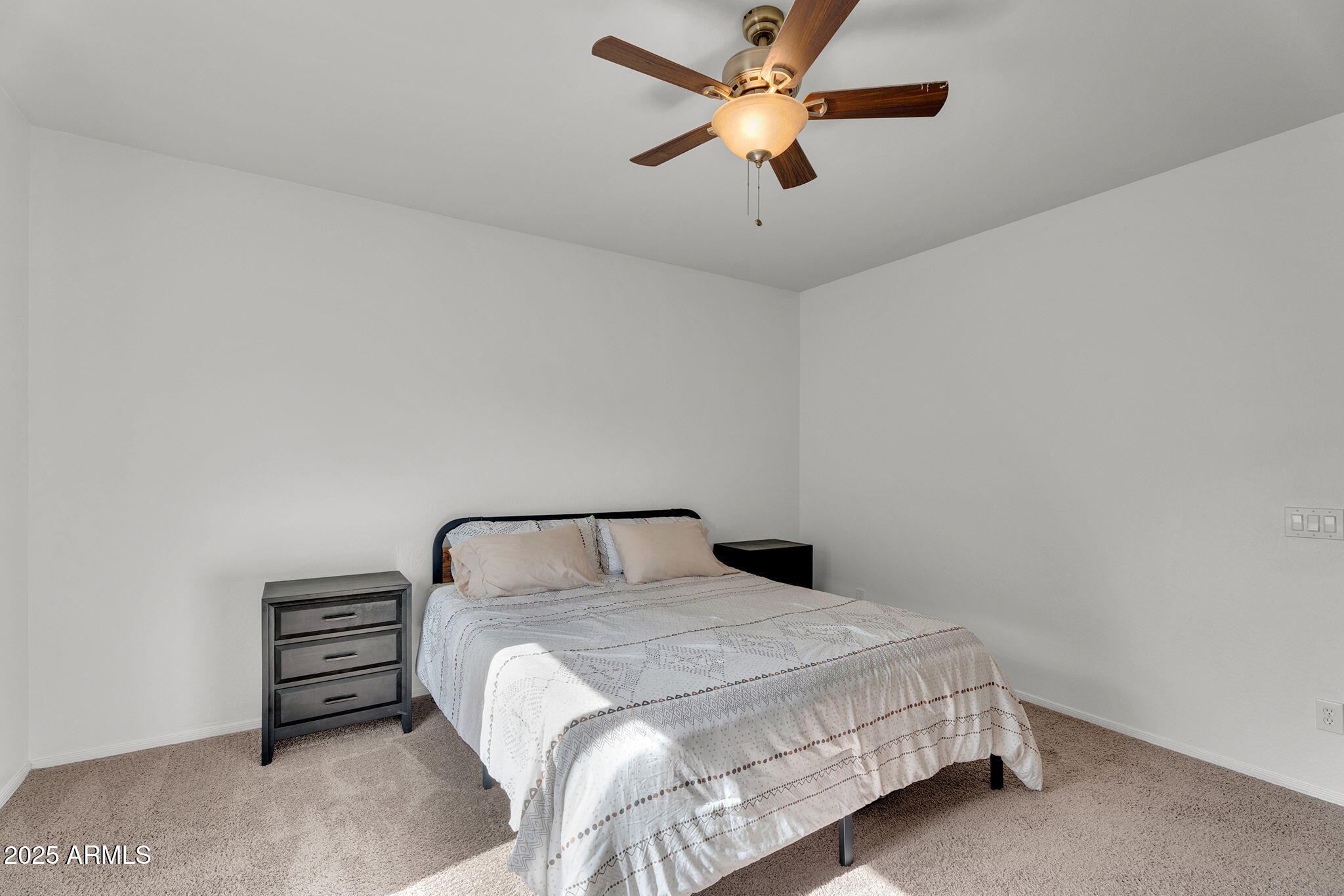 6579 West Georgetown Way Florence, AZ 85132 - Photo 20 of 60 a bedroom with a bed and a ceiling fan