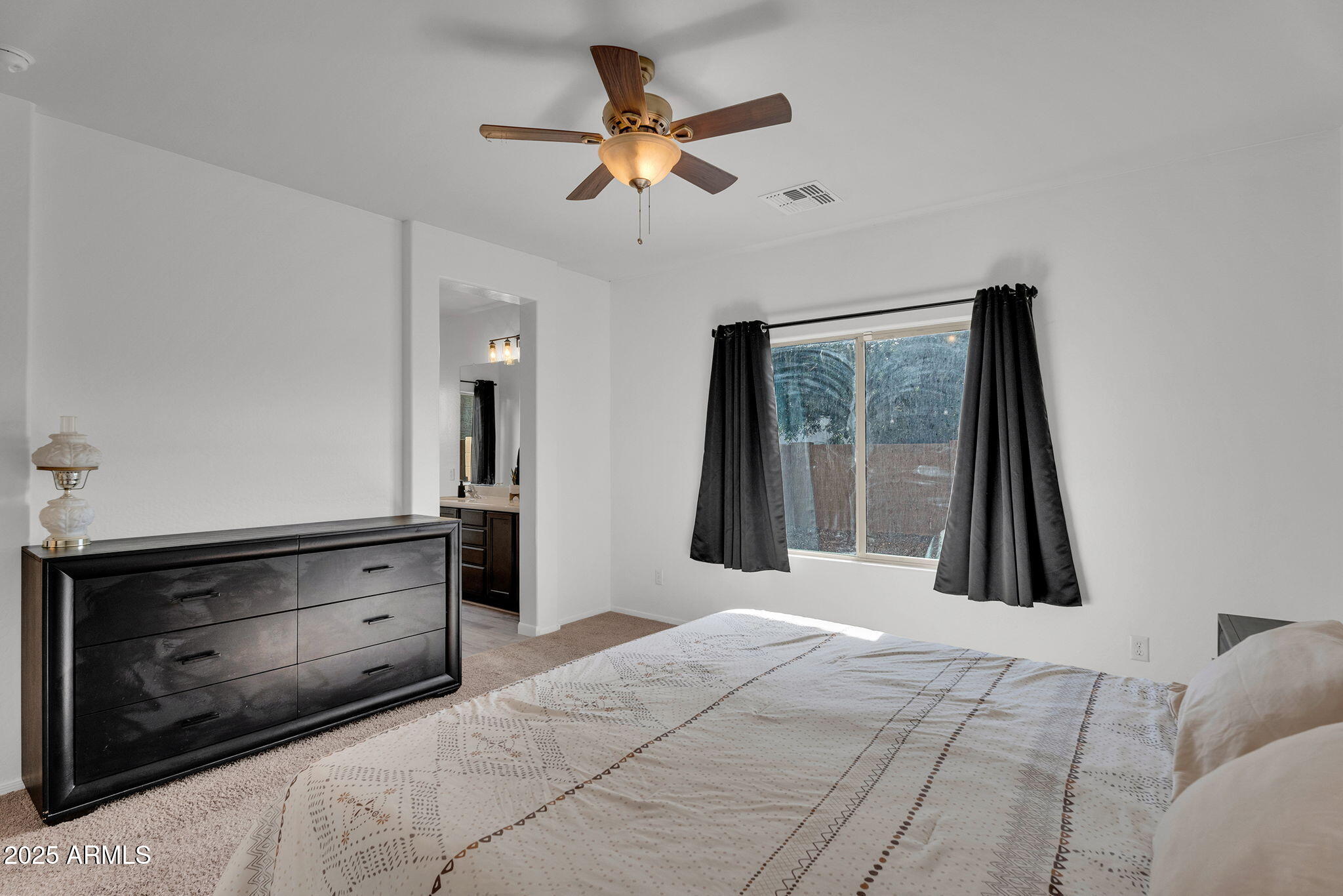 6579 West Georgetown Way Florence, AZ 85132 - Photo 21 of 60 a bedroom with a bed and a large mirror