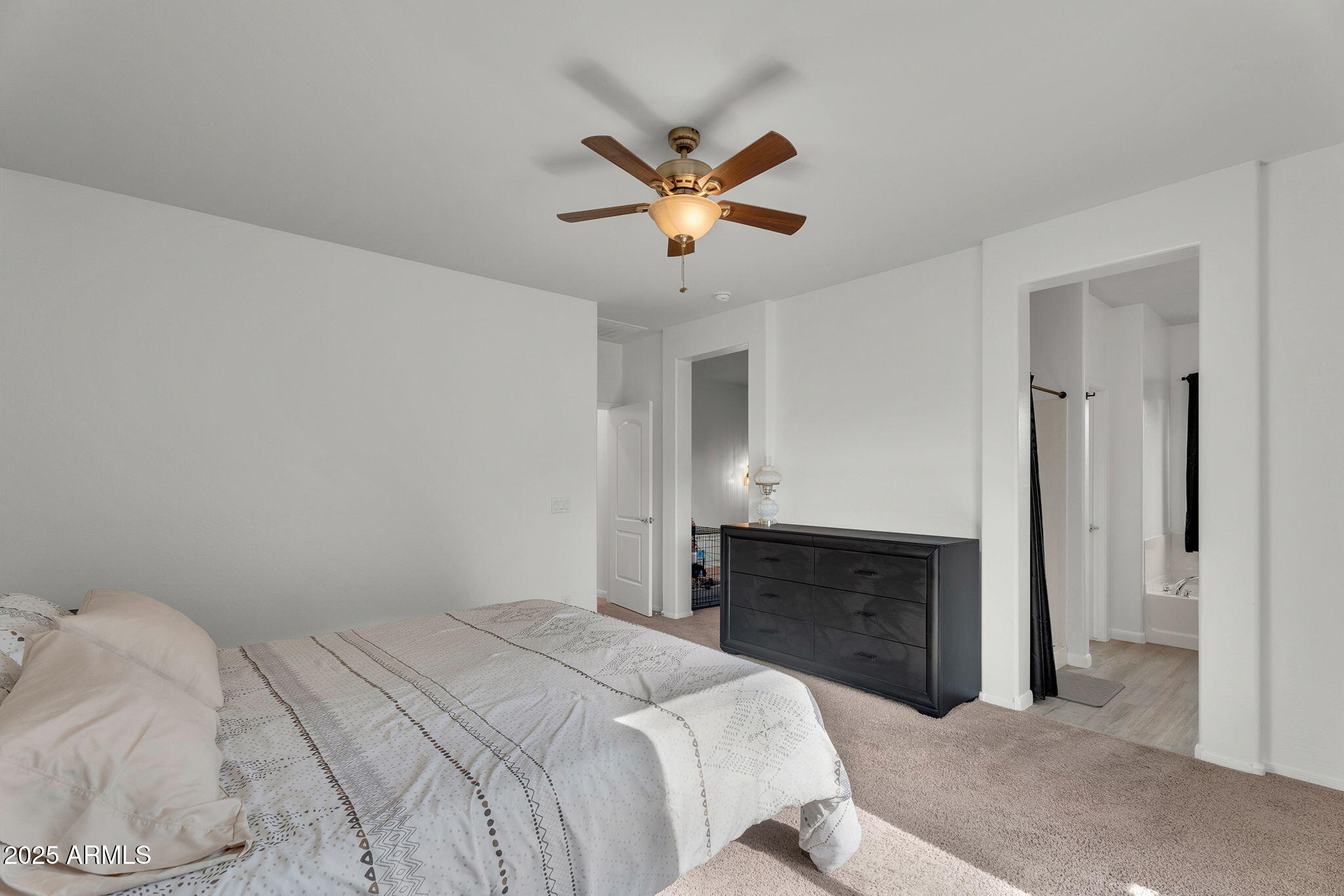 6579 West Georgetown Way Florence, AZ 85132 - Photo 22 of 60 a bedroom with a bed and a fireplace