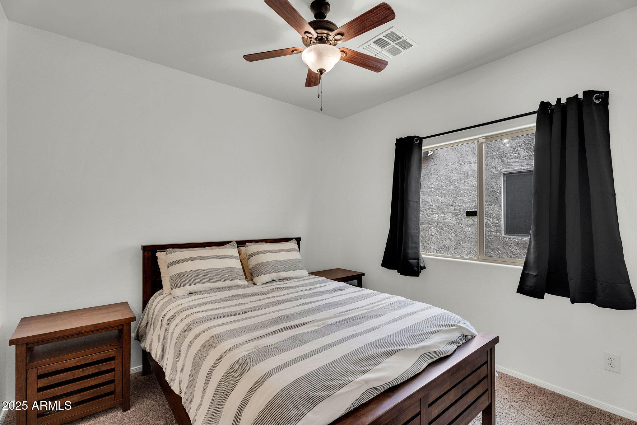 6579 West Georgetown Way Florence, AZ 85132 - Photo 28 of 60 a bedroom with a bed and a large mirror
