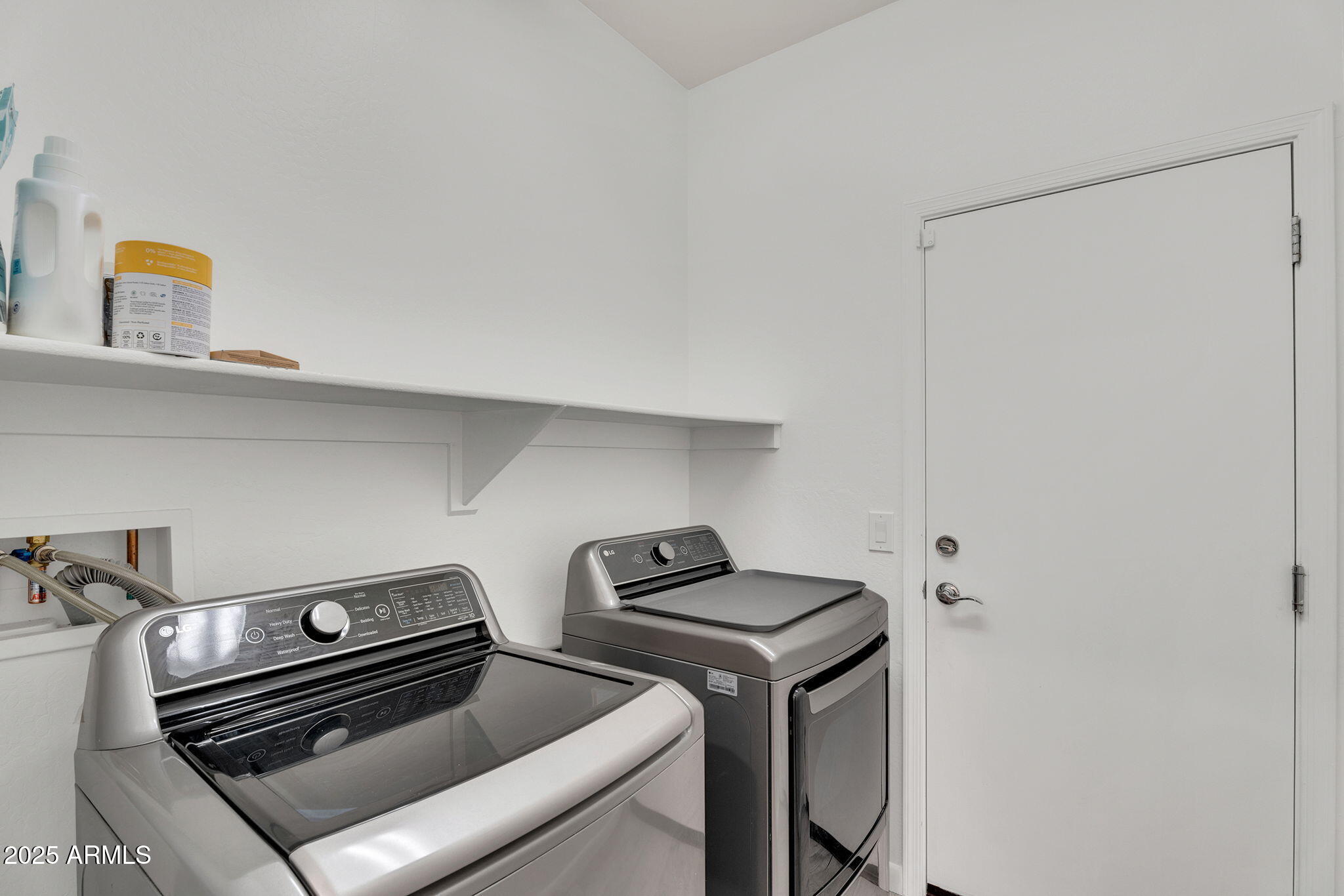 6579 West Georgetown Way Florence, AZ 85132 - Photo 32 of 60 a view of storage and utility room with washer and dryer