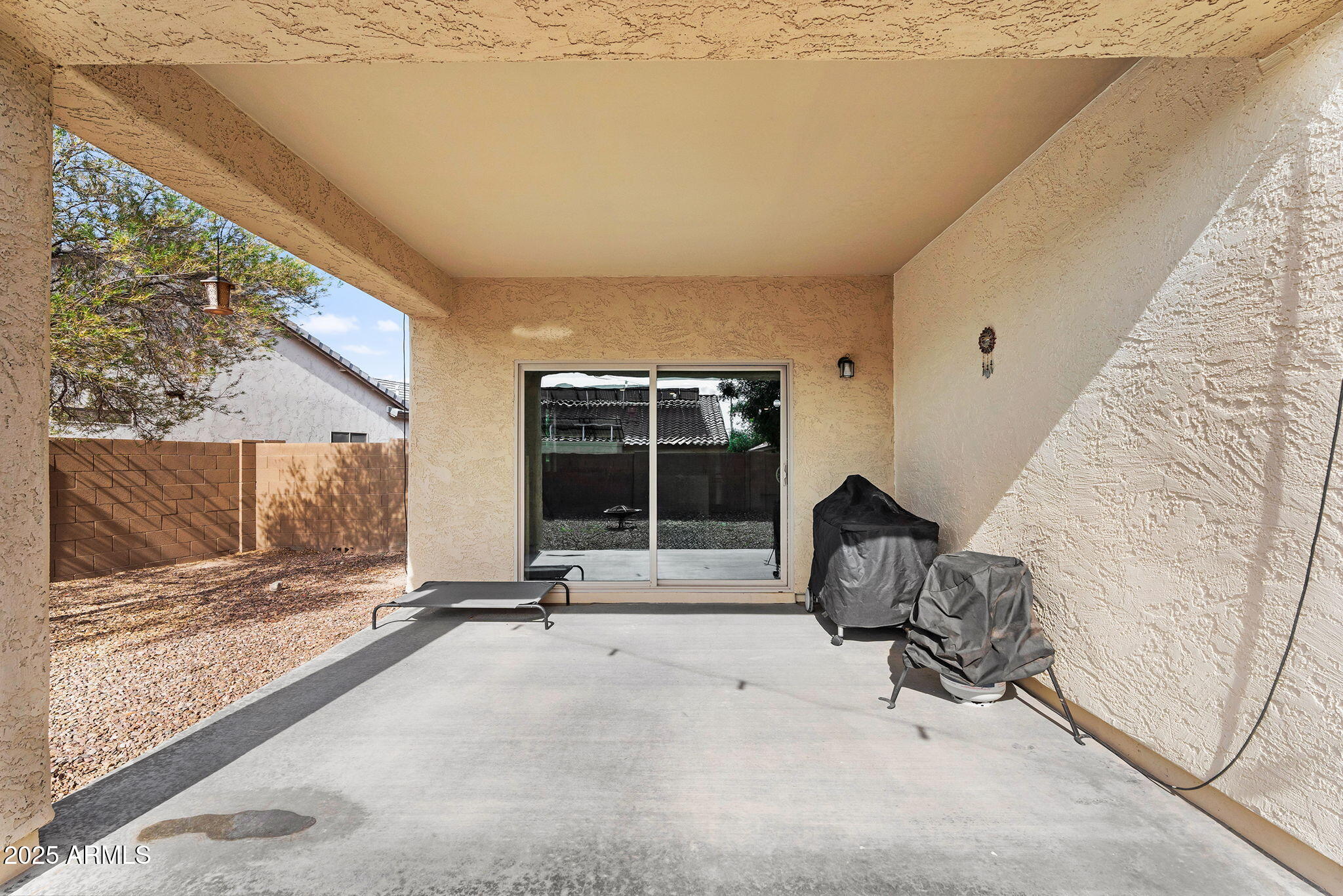 6579 West Georgetown Way Florence, AZ 85132 - Photo 34 of 60 a view of a room with gym equipment and floor to ceiling window