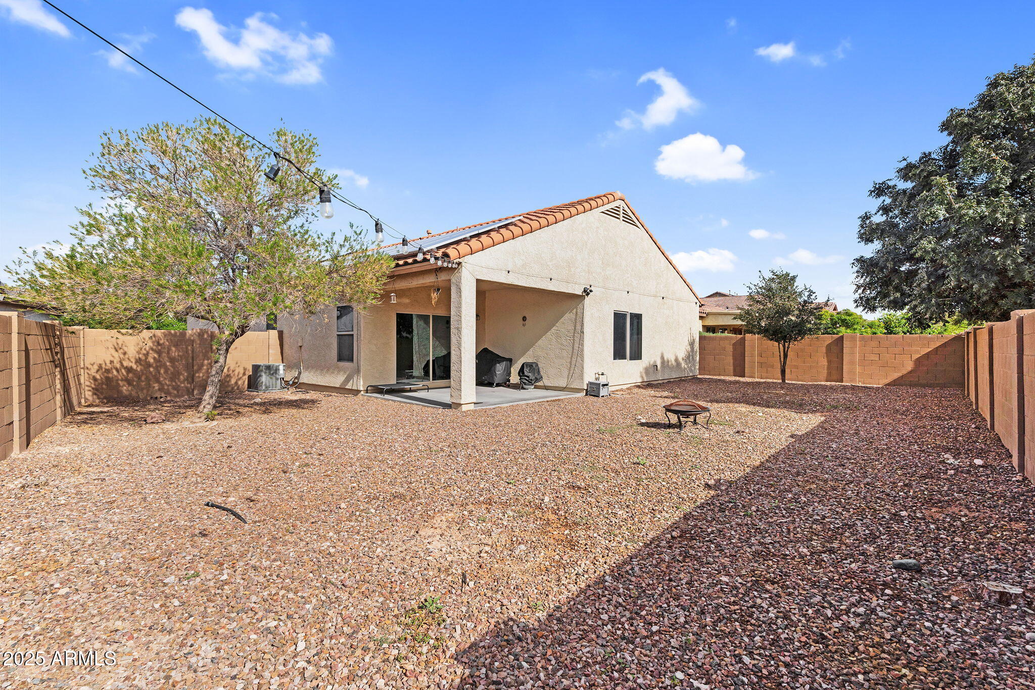 6579 West Georgetown Way Florence, AZ 85132 - Photo 35 of 60 a view of a house with a yard and a garage