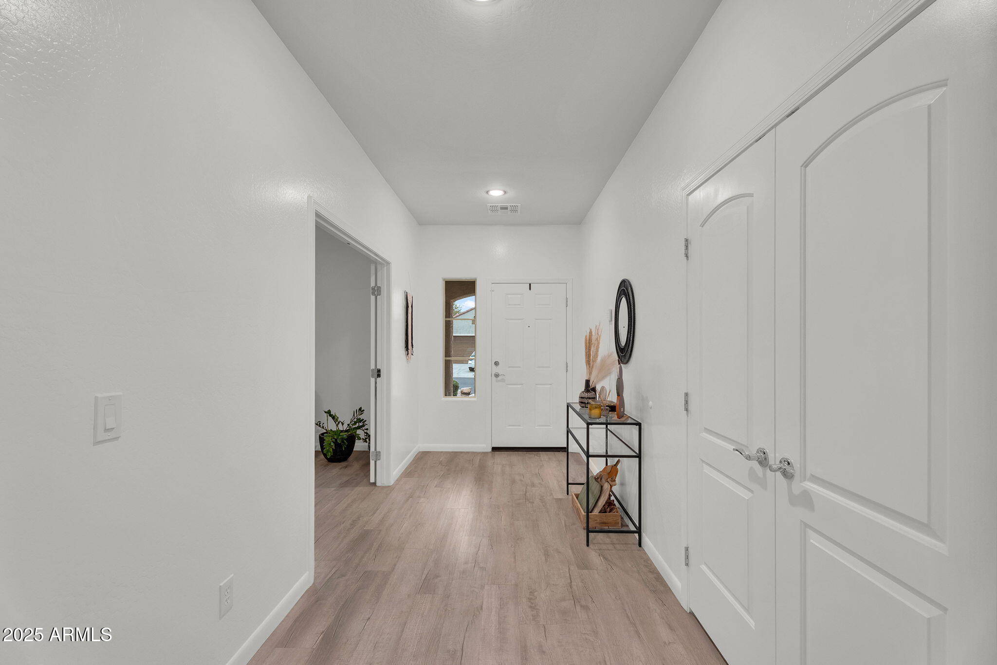 6579 West Georgetown Way Florence, AZ 85132 - Photo 6 of 60 a view of a room with wooden floor and stairs