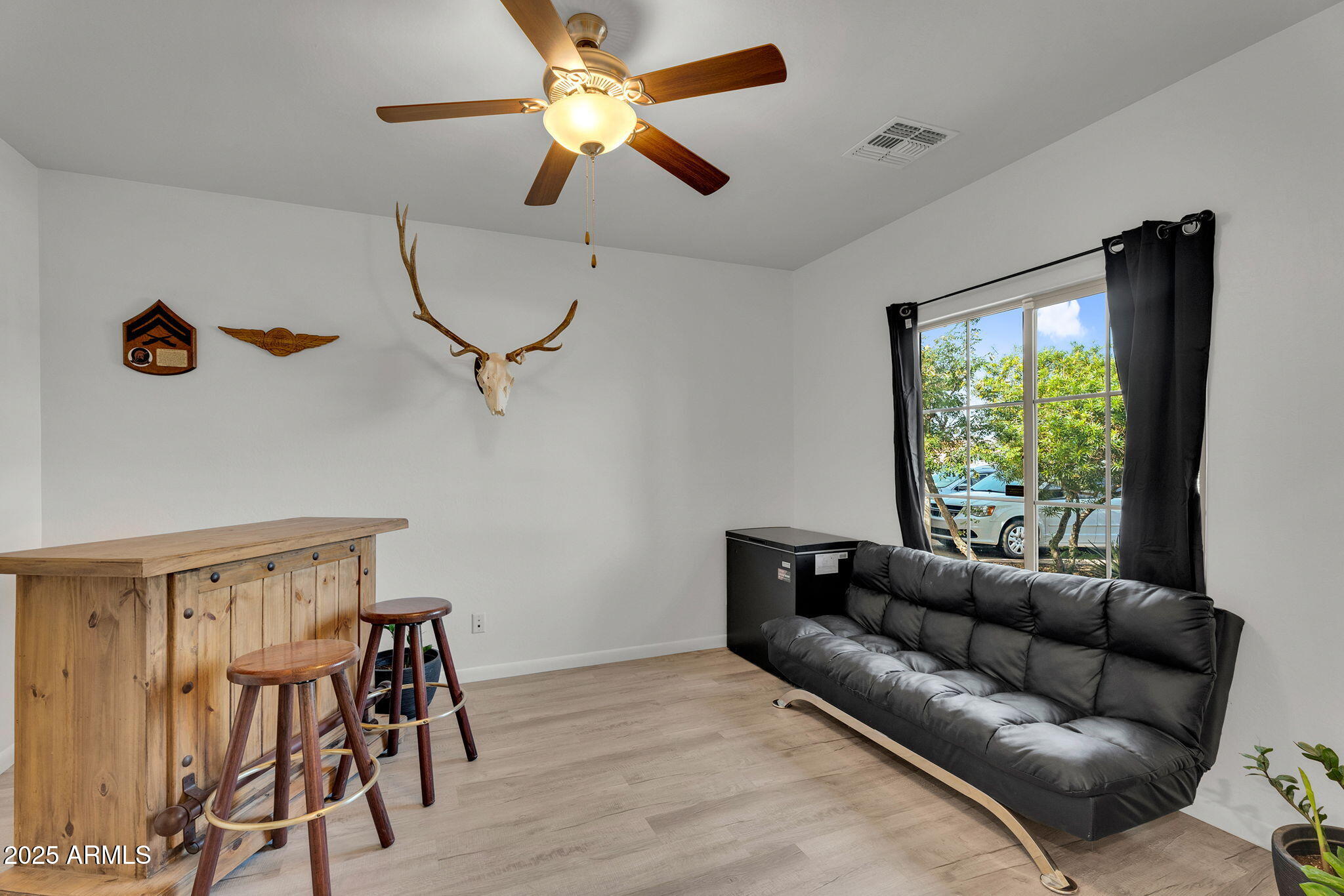 6579 West Georgetown Way Florence, AZ 85132 - Photo 7 of 60 a living room with furniture ceiling fan and a window
